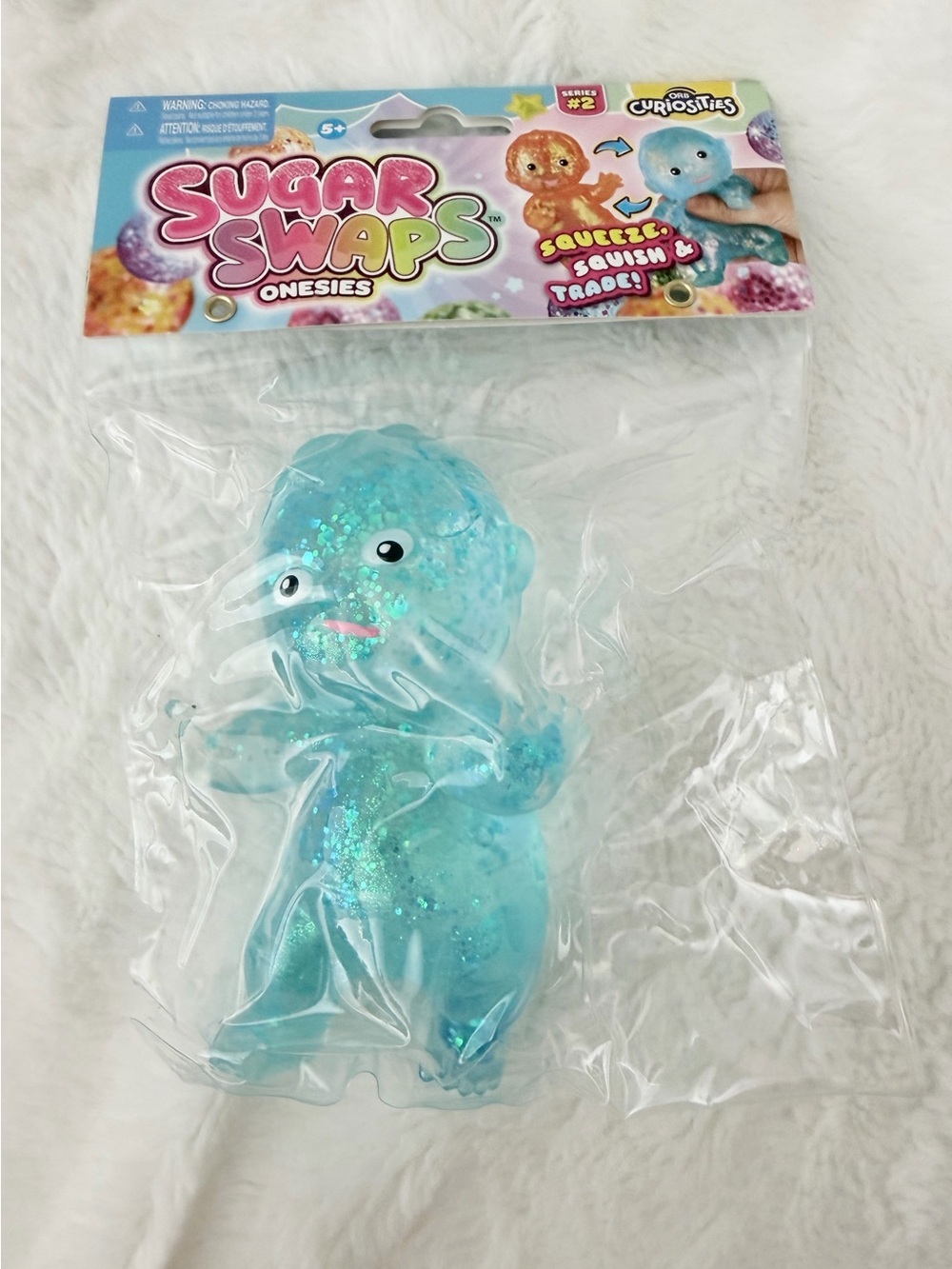 NWT ORB Curiosities Sugar Swaps Onesies Series 2 Blue Glitter Squishy Baby